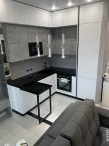 Миниатюра Кухня с бетонными фасадами и черной столешницей 6
